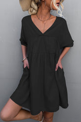 Mini-robe à poches nouées dans le dos